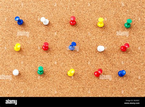 Group Of Thumbtacks Pinned On Cork Board Stock Photo Alamy