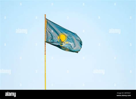 Kazakhstan flag on blue sky background. close up waving flag of Kazakhstan. flag symbols of ...