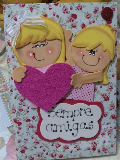 A Card With Two Girls Holding A Heart And The Words Empre Amigos On It