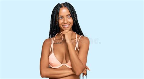 Beautiful Hispanic Woman Wearing Bikini With Hand On Chin Thinking