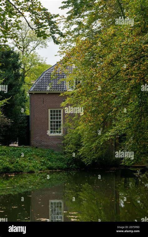 Side view of the Rhijnauwen castle next to trees in Bunnik a village in ...