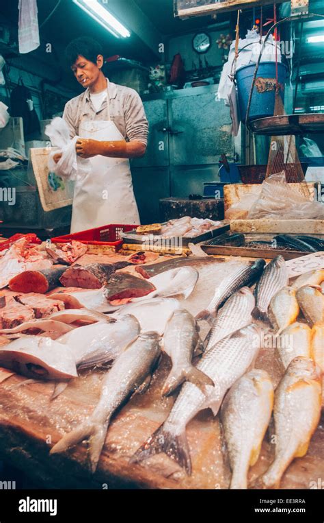 Asian Fishmonger Or Fish Seller In Hong Kong Wet Market Stock Photo Alamy