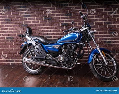 Blue Cruiser Motorcycle In Front Of Brick Wall Stock Photo Image Of