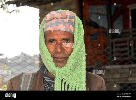 Portrait Of A Serious Looking Man With A Colourful Headscarf Pokhara