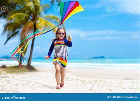 Child with Kite. Kids Play. Family Beach Vacation. Stock Photo - Image ...