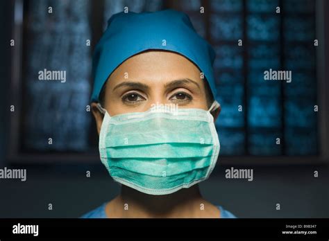 Portrait Of A Female Surgeon Wearing A Surgical Mask Stock Photo Alamy