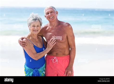 Cute Mature Couple Embracing On The Beach Stock Photo Alamy