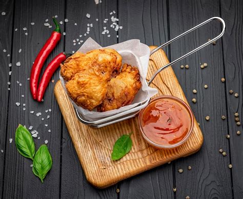 Premium Photo Fried Chicken Wings In Batter With Hot Sauce