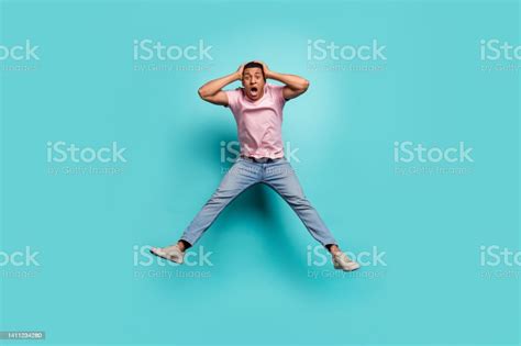 Full Length Photo Of Pretty Impressed Man Dressed Pink Tshirt Jumping