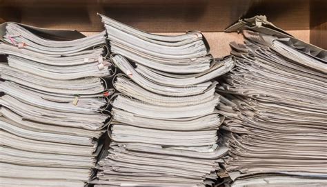 Old Paper Documents Stacked In Archive Documents On The Shelves Of