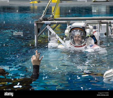 Nasa Astronaut Jessica Meir Descends Into The Pool In Her