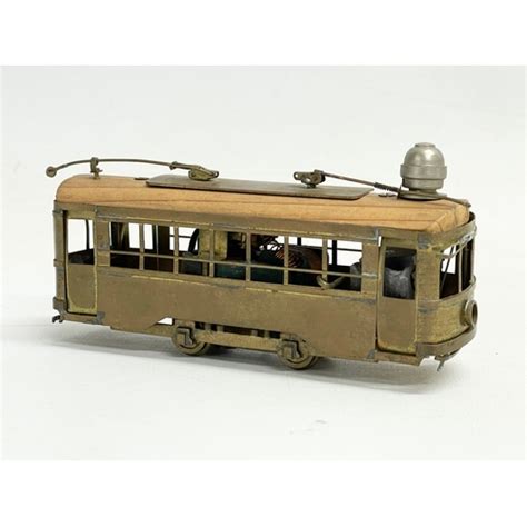 A Vintage Brass Mechanical Model Tram