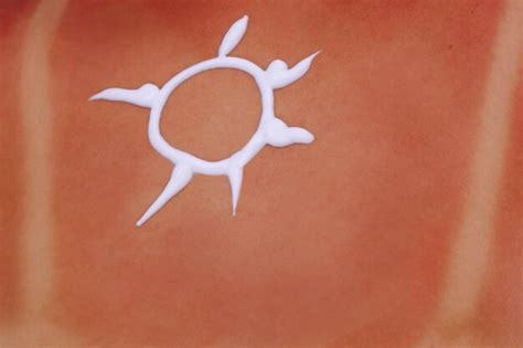 Premium Photo Closeup Of Picture Of Sun Painted With Sun Block Lotion