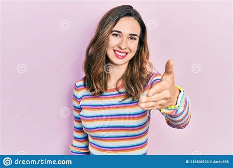 Young Hispanic Girl Wearing Casual Clothes Smiling Friendly Offering