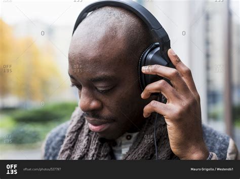 Bald Man Listening Music With Headphones Stock Photo OFFSET