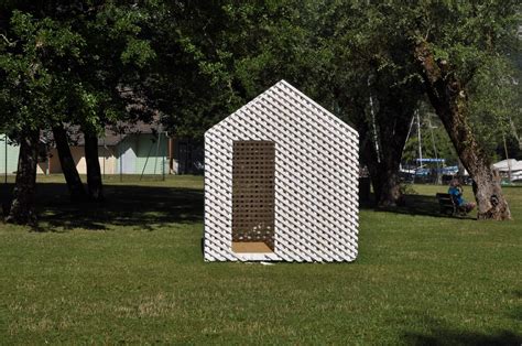 A Building Made Out Of Legos In The Grass