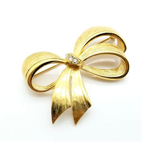 Vintage Avon Gold Tone And Rhinestone Bow Brooch Etsy Rhinestone Bow