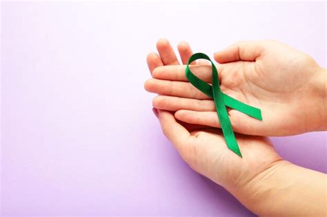 Premium Photo Female Hands Holding Green Organ Transplant Awareness