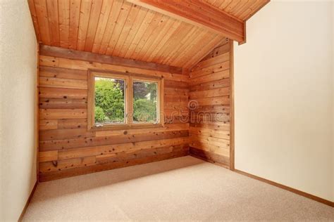 Empty Room Interior With Wooden Panel Trim Walls And Carpet Floor Stock