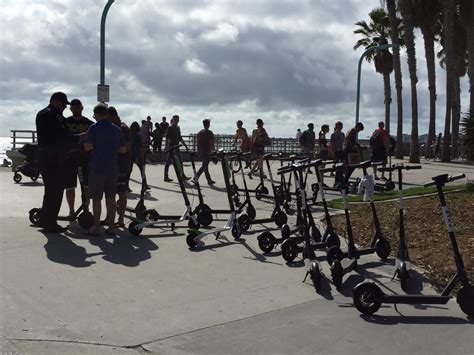 Bird And Lime Scooters On The BoardWalk Electric Scooter Rental