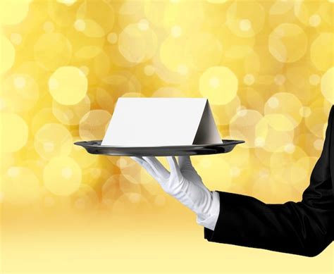 Premium Photo Waiter Or Butler Wearing A Tuxedo Holding A Note Card