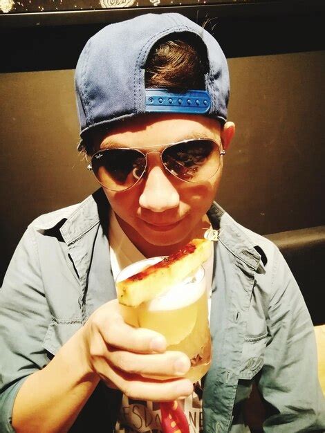 Premium Photo Portrait Of A Smiling Man Holding Ice Cream