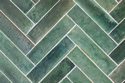 Green And Jade Handmade Retro Tiles In A Herringbone Pattern On The