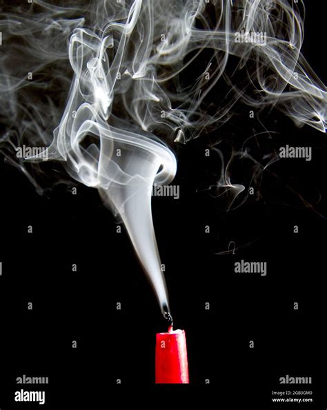 Wisp Of Smoke Rises From An Extinguished Candle Stock Photo Alamy