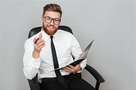 Free Photo Happy Smiling Businessman In Eyeglasses Holding Folder