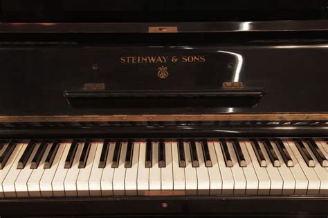 A Steinway Model K Upright Piano For Sale With A Black Case And