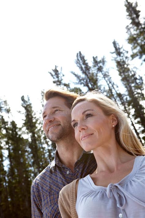 Confident Couple A Loving Mature Couple Standing Together In Nature