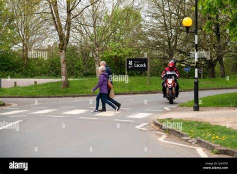 national trust welcome to Lacock sign white letters on black Stock Photo - Alamy