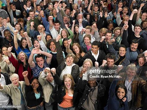 106 Crowd Of People Cheering Arms Raised Elevated View Stock Photos