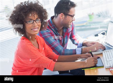 Graphic Designer Using A Graphics Tablet In Her Office Stock Photo Alamy