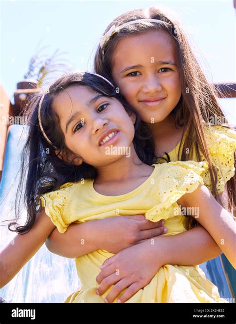 Were Sisters And Best Friends Shot Of A Young Girl Embracing Her