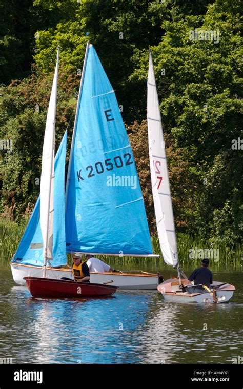 Three Sailing Boats On Mote Park Lake On A Sunny Day In Maidstone Kent