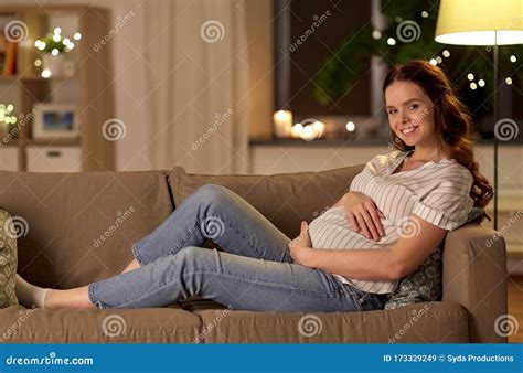 Happy Smiling Pregnant Woman On Sofa At Home Stock Image Image Of