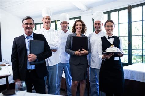 Premium Photo Happy Restaurant Team Standing Together In Restaurant