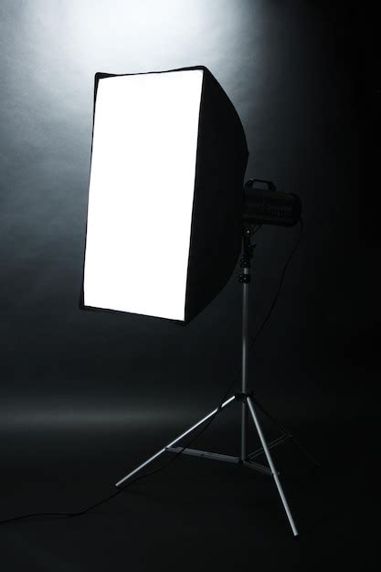 Premium Photo Studio Flash With Softbox On Black Studio Background