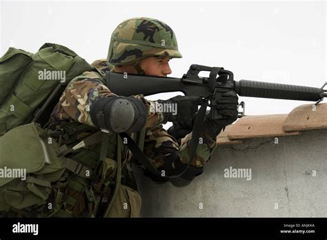 Side Profile Of A Soldier Aiming His Rifle Stock Photo Alamy