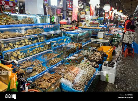 Seafood In Water Tanks And People At The Noryangjin Fisheries Wholesale