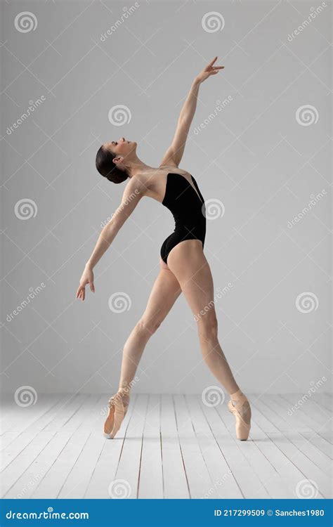 Young Beautiful Skinny Ballerina Is Posing In Studio Stock Image