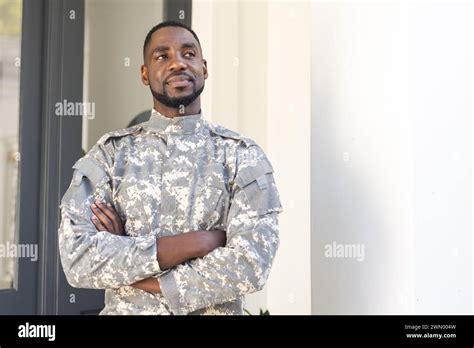 African American Soldier In Military Uniform Stands Confidently With