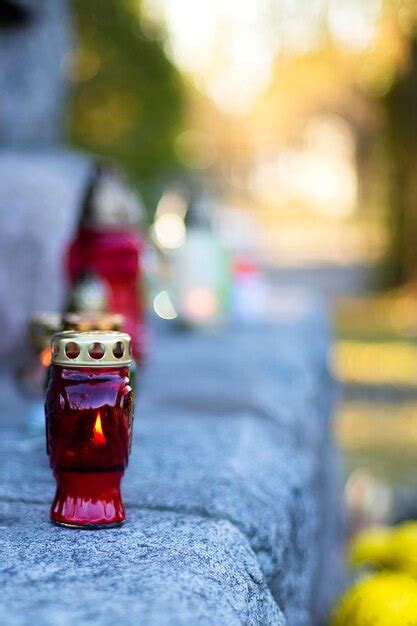 Premium Photo Red Candle At The Cemetery