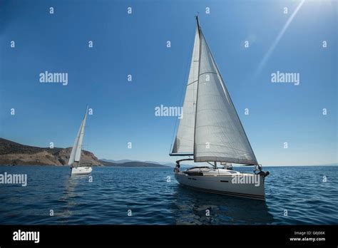 Two Luxury Yachts Sailing On The Sea Stock Photo Alamy