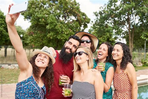 Six Cheerful Friends Making Selfie By Stocksy Contributor Guille