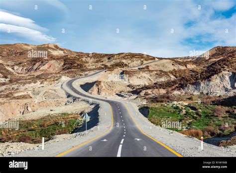 Winding road in mountains area Stock Photo - Alamy