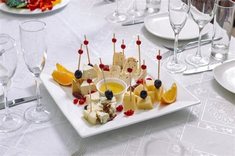 Premium Photo | Plate of cheese and fruit