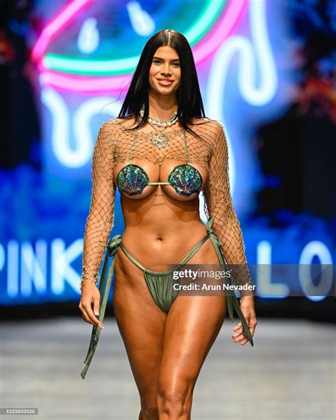 Lucciana Beynon walks the runway wearing Pink Melon Swimwear during ...