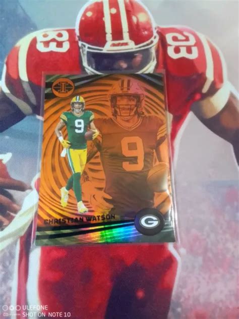 2023 PANINI ILLUSIONS Football Christian Watson Orange Green Bay